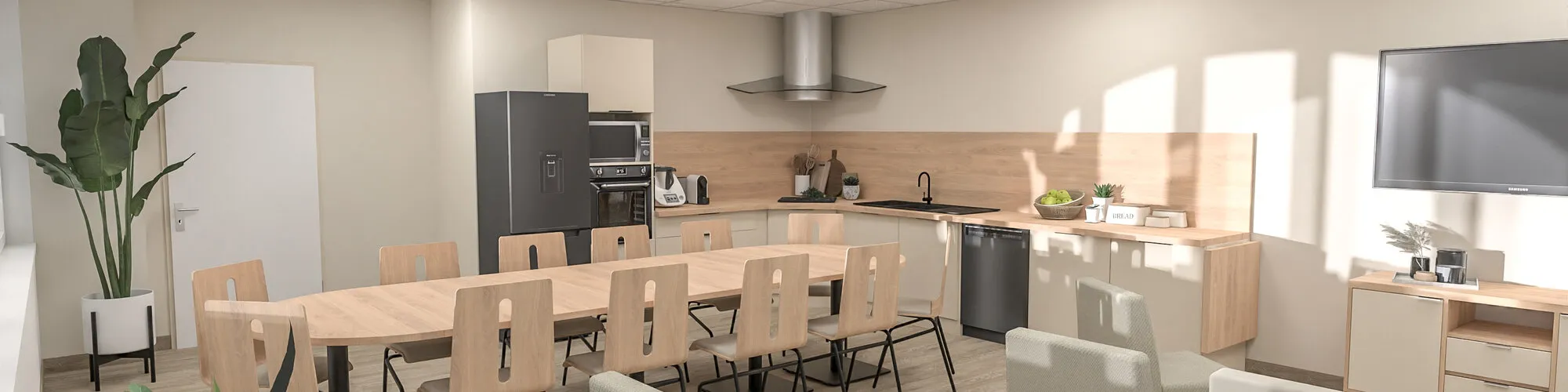 Salle commune d'établissement : grande table de repas, cuisine et coin salon